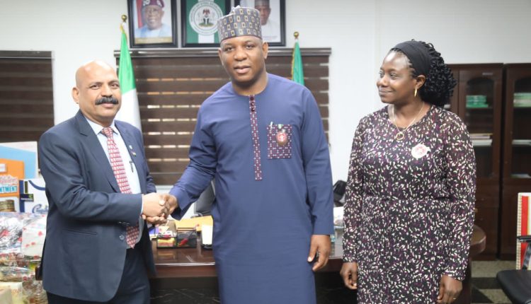 The Nigerian Minister of Steel Development, Prince Shuaibu Abubakar Audu (M) flanked by Dr Mary Ogbe and Mukesh Sharma (Nigerian Mining)